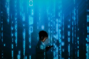 woman using a smartphone with blue digital rain in the background